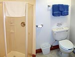 Every bedroom in the Tabby Mountain Lodge has its own private bathroom, left shows a shower and right a toilet.