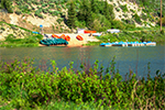 Reid Ranch lake with dock and boats in the background, for desktop background.