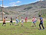 Youth enjoy the competition of a soccer game.