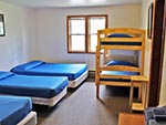 A view of one bedroom in the Red Creek Lodge, each bedroom is a unique style.