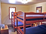 A view of one bedroom in the Red Creek Lodge, each bedroom is a unique style.