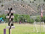 Old wooden signs guide guests to different activities and buildings.