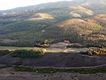 An aerial view of the plateau shows space available for activity and buildings at Reid Ranch.