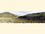 A panoramic view of Reid Ranch shows the lake, the plateau, and surrounding hills.