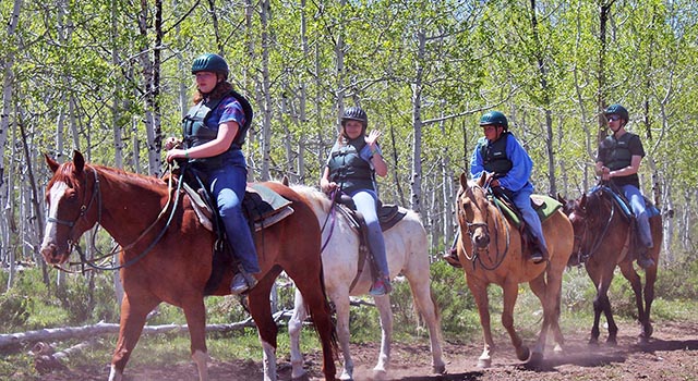Picture of the horseback riding activity (links to the online waiver information page)