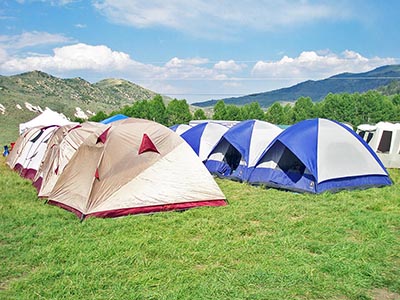 A group of well-organized campers pitched their similar style tents in nice neat rows.