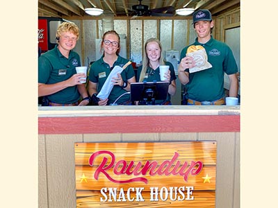 Reid Ranch employee's show snacks and drinks available at the Roundup Snack House.