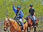 A boy shows his excitement while riding a horse (one of the favorite activities that Reid Ranch offers).