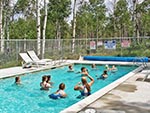 Youth play a game of pool ball in the Tabby Mountain Lodge's pool.