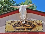 Reid Ranch Trading Post follows the western theme and is decorated with a bull skull and wooden sign.
