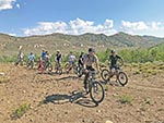 The smiles can be seen on these cyclists as they pause on the trail.