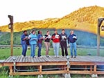 A view of the Stage.  Seven teachers stand on the stage performing a skit.