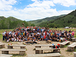 A large group photo on and around the stage.