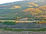 Atop a plateau, Reid Ranch's facilities are visible.